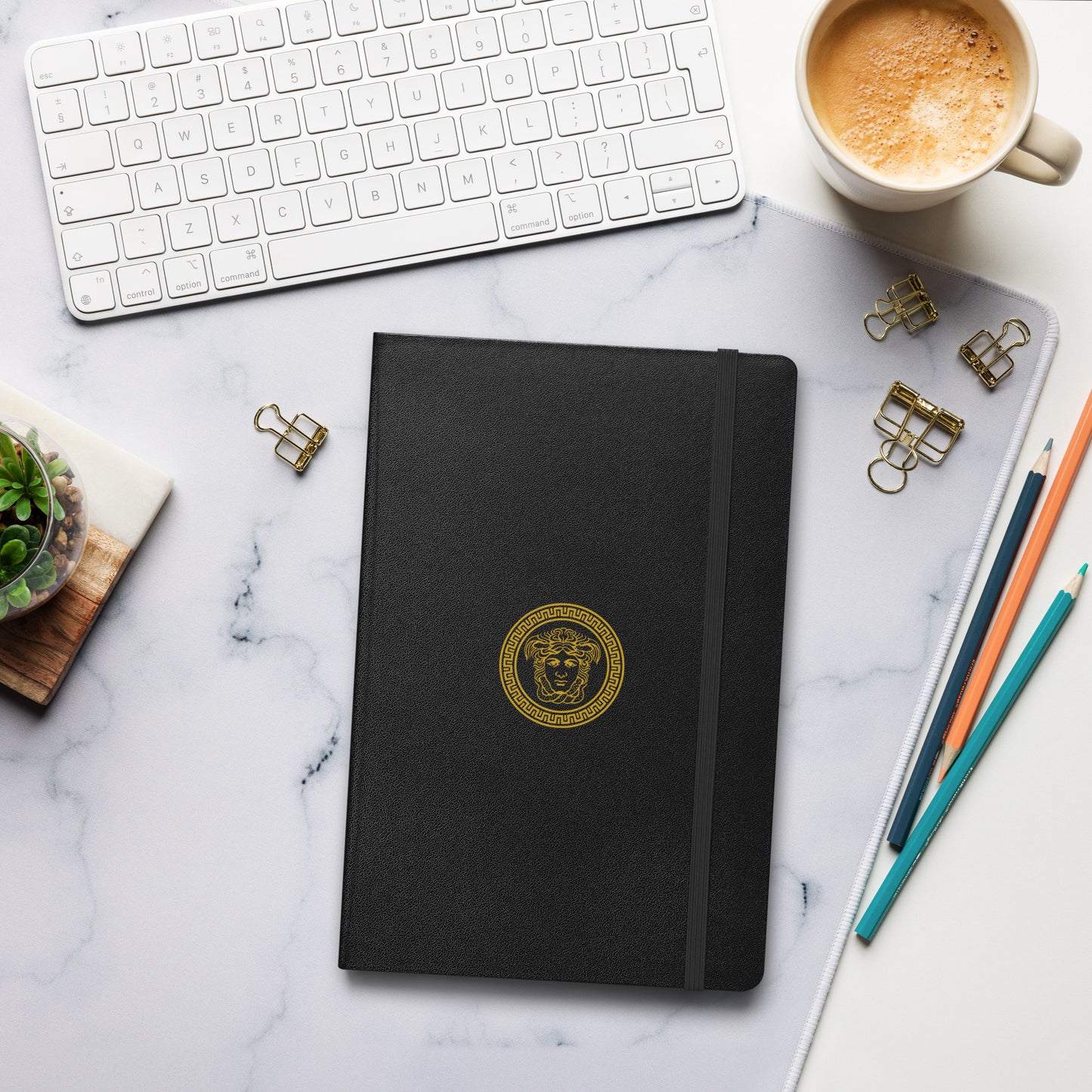 Stylish Hardcover bound notebook in black with distinct Medusa Emblem