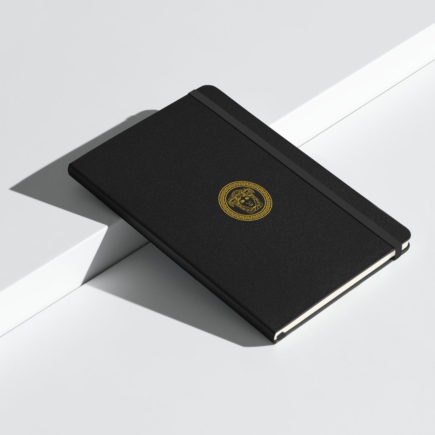 Stylish Hardcover bound notebook in black with distinct Medusa Emblem